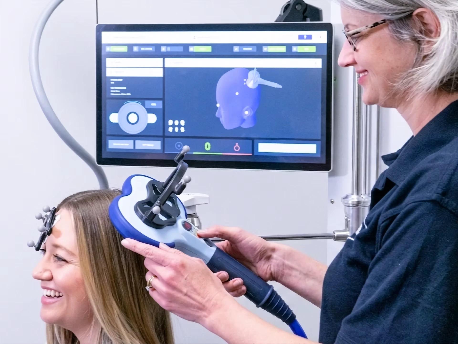 A clinician performs an initial mapping session using Magstim Horizon TMS.